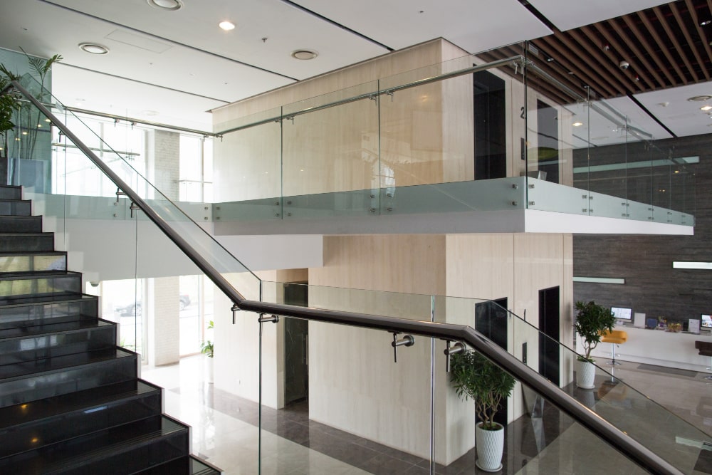 contemporary office interior with glass staircase after commercial renovation in milton.