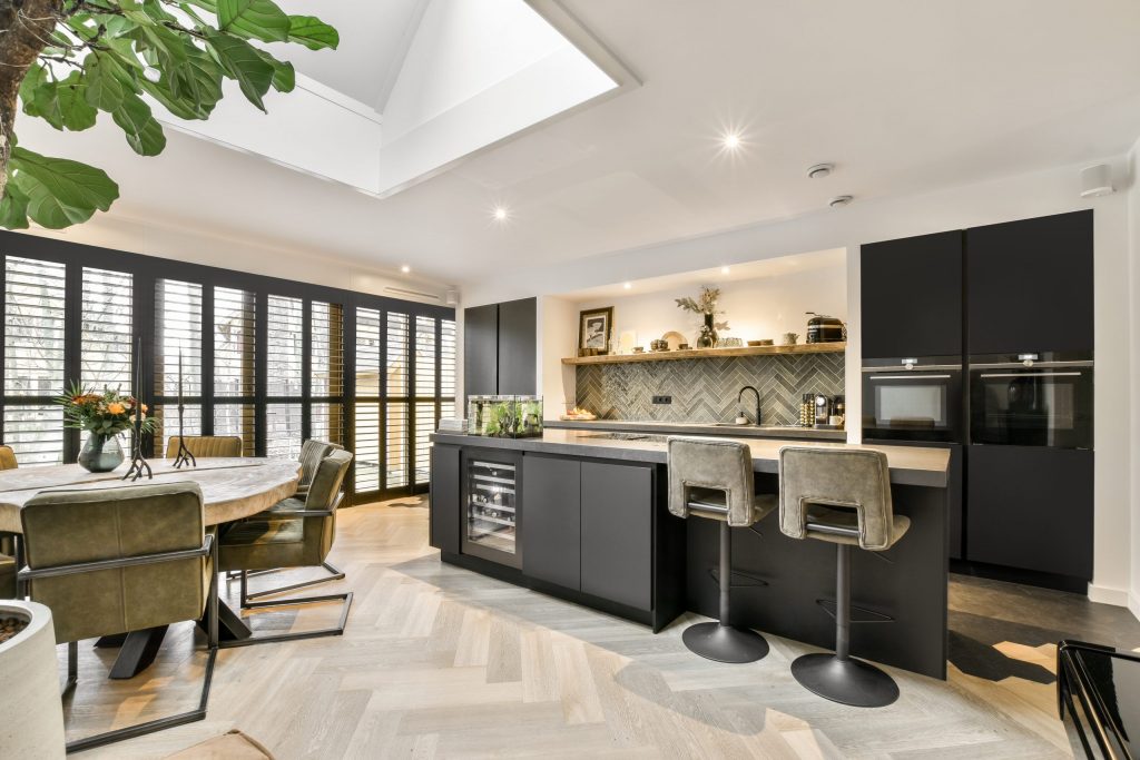 modern kitchen and dining area after commercial renovation in toronto.